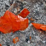 Wulfenite with CalciteMina Red Cloud, Montes Trigo, Distrito minero Silver, Condado La Paz, Arizona, USAmain crystal size: 1.3 × 1.1 cm (Author: Jordi Fabre)