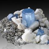 Beryl (variety aquamarine) with Orthoclase and Mica (Group)<br />Pikar Mine, Chumar Bakhoor, Sumayar Valley, Nagar District, Gilgit-Baltistan (Northern Areas), Pakistan<br />11 x 9 x 5.5 cm / main crystal: 3.2 cm.<br /> (Author: MIM Museum)