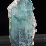 Euclase with CalciteMina La Marina, Municipio Pauna, Cinturón Esmeraldífero Occidenta, Departamento Boyacá, Colombia3.1 × 1.5 × 0.8 cm / main crystal size: 3 × 0.8 cm (Author: Jordi Fabre)