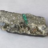Beryl (variety emerald), Calcite, Dolomite, Albite (var. Cleavelandite), PyriteChivor mining district, Mirador Mine, Municipio Chivor, Eastern Emerald Belt, Boyacá Department, Colombia46x20x21 mm, xl=9 mm (Author: Fiebre Verde)