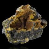 Uraninite with UranophaneShinkolobwe, Cinturón de cobre de Katanga, Katanga (Shaba), República Democrática del Congo (Zaire)6.5 x 4.5 x 5 cm / main crystal: 1.3 cm. (Author: MIM Museum)