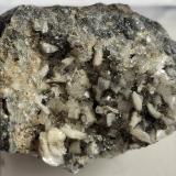 Dickite, Pyrite<br />Mas d'Alary mining area, Lodève commune, Lodève District, Hérault, Occitanie, France<br />2 x 1,6 cm<br /> (Author: Volkmar Stingl)