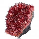 Rhodochrosite on  manganese oxidesN'Chwaning mining area, Kuruman, Kalahari manganese field (KMF), Northern Cape Province, South Africa12 x 9 x 7.5 cm / main crystal: 1.5 cm (Author: MIM Museum)