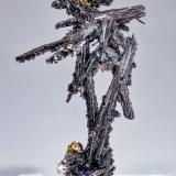 Cosalite with FluoriteMina Solnechnoye, distrito minero Kara-Oba, Desierto Betpak-Dala (Bet-Pak-Dala), Región Karaganda, KazajstánSpecimen size: 4.1 × 2.4 × 2.3 cm / main crystal of Cosalite: 4.1 × 0.7 cm (Author: Jordi Fabre)