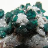 Dioptase on Calcite<br />Tsumeb Mine, Tsumeb, Otjikoto Region, Namibia<br />50x35mm<br /> (Author: Heimo Hellwig)