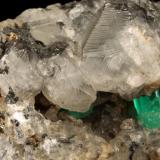 Beryl (variety emerald), Calcite, PyriteLa Pita (distrito minero), Municipio Maripí, Cinturón Esmeraldífero Occidental, Departamento Boyacá, Colombia7cm across (Author: Fiebre Verde)