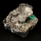 Beryl (variety emerald), Calcite, PyriteLa Pita (distrito minero), Municipio Maripí, Cinturón Esmeraldífero Occidental, Departamento Boyacá, Colombia7cm across (Author: Fiebre Verde)