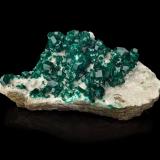 Dioptase on Calcite<br />Tsumeb Mine, Tsumeb, Otjikoto Region, Namibia<br />26,0	x	13,0	x	12,5	cm<br /> (Author: MIM Museum)