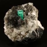 Beryl (variety emerald), Calcite, Pyrite<br />La Pita mining district, Cunas Mine, Municipio Maripí, Western Emerald Belt, Boyacá Department, Colombia<br />50x50x45mm, xl=11x7mm<br /> (Author: Fiebre Verde)