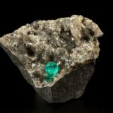 Beryl (variety emerald), Calcite, Dolomite, Pyrite<br />Chivor mining district, Municipio Chivor, Eastern Emerald Belt, Boyacá Department, Colombia<br />44x34x39mm, xl=7mm<br /> (Author: Fiebre Verde)