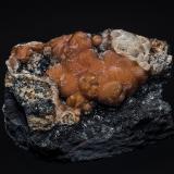 Rhodochrosite, ManganiteMina N'Chwaning II, Zona minera N'Chwaning, Kuruman, Kalahari manganese field (KMF), Provincia Septentrional del Cabo, Sudáfrica6.1 x 4.6 cm (Author: am mizunaka)
