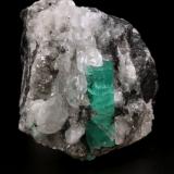 Beryl (variety emerald), Calcite<br />La Pita mining district, Polveros Mine, Municipio Maripí, Western Emerald Belt, Boyacá Department, Colombia<br />41x52x59mm, xl=26x9mm<br /> (Author: Fiebre Verde)