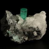 Beryl (variety emerald), Calcite<br />La Pita mining district, Polveros Mine, Municipio Maripí, Western Emerald Belt, Boyacá Department, Colombia<br />45x32x28mm, xl=18x7mm<br /> (Author: Fiebre Verde)