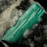 Beryl (variety emerald), Calcite<br />Muzo mining district, Western Emerald Belt, Boyacá Department, Colombia<br />58x31x34mm, xl aggregate=25x8mm<br /> (Author: Fiebre Verde)