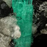 Beryl (variety emerald), Calcite<br />Muzo mining district, Western Emerald Belt, Boyacá Department, Colombia<br />58x31x34mm, xl aggregate=25x8mm<br /> (Author: Fiebre Verde)