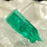 Beryl (variety emerald), Calcite<br />La Pita mining district, Municipio Maripí, Western Emerald Belt, Boyacá Department, Colombia<br />35x38x37mm, main xl=12x4mm<br /> (Author: Fiebre Verde)