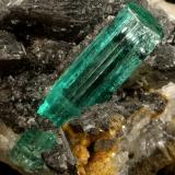 Beryl (variety emerald), Calcite<br />Muzo mining district, Western Emerald Belt, Boyacá Department, Colombia<br />62x27x39mm, original xl=25mm<br /> (Author: Fiebre Verde)