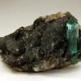 Beryl (variety emerald), Calcite<br />Muzo mining district, Western Emerald Belt, Boyacá Department, Colombia<br />62x27x39mm, original xl=25mm<br /> (Author: Fiebre Verde)