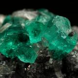 Beryl (variety emerald), Calcite<br />La Pita mining district, Municipio Maripí, Western Emerald Belt, Boyacá Department, Colombia<br />27x40x31mm, aggregate=15x13mm<br /> (Author: Fiebre Verde)