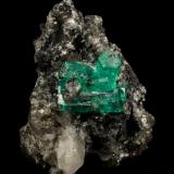 Beryl (variety emerald), Calcite<br />La Pita mining district, Municipio Maripí, Western Emerald Belt, Boyacá Department, Colombia<br />27x40x31mm, aggregate=15x13mm<br /> (Author: Fiebre Verde)