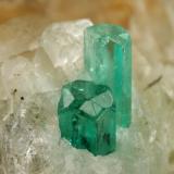 Beryl (variety emerald), Calcite, Quartz, GoethiteMina Peñas Blancas, Municipio San Pablo de Borbur, Cinturón Esmeraldífero Occidental, Departamento Boyacá, Colombia49x52x70mm, main xl=7x4mm (Author: Fiebre Verde)