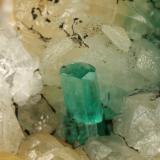 Beryl (variety emerald), Calcite, Quartz, GoethiteMina Peñas Blancas, Municipio San Pablo de Borbur, Cinturón Esmeraldífero Occidental, Departamento Boyacá, Colombia49x52x70mm, main xl=7x4mm (Author: Fiebre Verde)