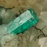 Beryl (variety emerald), Calcite, Quartz, GoethiteMina Peñas Blancas, Municipio San Pablo de Borbur, Cinturón Esmeraldífero Occidental, Departamento Boyacá, Colombia49x52x70mm, main xl=7x4mm (Author: Fiebre Verde)