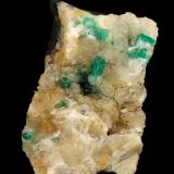 Beryl (variety emerald), Calcite, Quartz, GoethiteMina Peñas Blancas, Municipio San Pablo de Borbur, Cinturón Esmeraldífero Occidental, Departamento Boyacá, Colombia49x52x70mm, main xl=7x4mm (Author: Fiebre Verde)