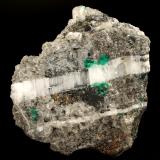 Beryl (variety emerald), Calcite, PyriteLa Pita (distrito minero), Mina Cunas, Municipio Maripí, Cinturón Esmeraldífero Occidental, Departamento Boyacá, Colombia80x40x90mm - xls up to 8mm (Author: Fiebre Verde)