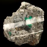 Beryl (variety emerald), Calcite, Pyrite<br />La Pita mining district, Cunas Mine, Municipio Maripí, Western Emerald Belt, Boyacá Department, Colombia<br />80x40x90mm - xls up to 8mm<br /> (Author: Fiebre Verde)