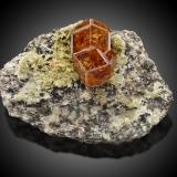 Grossular (variety hessonite) and Diopside<br />Jeffrey Mine, Asbestos, Les Sources RCM, Estrie, Québec, Canada<br />10,0	x	7,0	x	6,5	cm<br /> (Author: MIM Museum)
