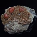 Rhodochrosite, AlbiteFoote Lithium Co. Mine (Foote Mine), Kings Mountain District, Cleveland County, North Carolina, USA5.0 x 3.8 cm (Author: am mizunaka)