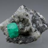 Beryl (variety emerald), Calcite, Dolomite, Pyrite<br />Coscuez mining district, Municipio San Pablo de Borbur, Western Emerald Belt, Boyacá Department, Colombia<br />27x24x35mm, xl=9x6mm<br /> (Author: Fiebre Verde)