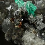 Beryl (variety emerald), Calcite, Dolomite, Pyrite, Quartz<br />La Pita mining district, Cunas Mine, Municipio Maripí, Western Emerald Belt, Boyacá Department, Colombia<br />66x49x24mm, main xl=6x4mm<br /> (Author: Fiebre Verde)