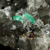 Beryl (variety emerald), Calcite, Dolomite, Pyrite, Quartz<br />La Pita mining district, Cunas Mine, Municipio Maripí, Western Emerald Belt, Boyacá Department, Colombia<br />66x49x24mm, main xl=6x4mm<br /> (Author: Fiebre Verde)