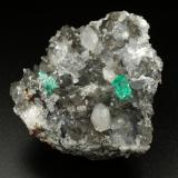 Beryl (variety emerald), Calcite, Dolomite, Pyrite, Quartz<br />La Pita mining district, Cunas Mine, Municipio Maripí, Western Emerald Belt, Boyacá Department, Colombia<br />66x49x24mm, main xl=6x4mm<br /> (Author: Fiebre Verde)