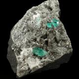 Beryl (variety emerald), Calcite, Dolomite<br />Chivor mining district, Municipio Chivor, Eastern Emerald Belt, Boyacá Department, Colombia<br />87x64x61mm, largest xl=5mm<br /> (Author: Fiebre Verde)