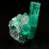 Beryl (variety emerald), Calcite<br />La Pita mining district, Polveros Mine, Municipio Maripí, Western Emerald Belt, Boyacá Department, Colombia<br />main xl=18x4.5mm<br /> (Author: Fiebre Verde)