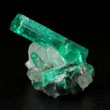 Beryl (variety emerald), Calcite<br />La Pita mining district, Polveros Mine, Municipio Maripí, Western Emerald Belt, Boyacá Department, Colombia<br />main xl=18x4.5mm<br /> (Author: Fiebre Verde)