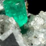 Beryl (variety emerald), Calcite, Dolomite, Pyrite<br />La Pita mining district, Polveros Mine, Municipio Maripí, Western Emerald Belt, Boyacá Department, Colombia<br />27x30x33mm, xl=9x6mm<br /> (Author: Fiebre Verde)