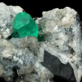 Beryl (variety emerald), Calcite, Dolomite, Pyrite<br />La Pita mining district, Polveros Mine, Municipio Maripí, Western Emerald Belt, Boyacá Department, Colombia<br />27x30x33mm, xl=9x6mm<br /> (Author: Fiebre Verde)