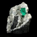 Beryl (variety emerald), Calcite, Dolomite, Pyrite<br />La Pita mining district, Polveros Mine, Municipio Maripí, Western Emerald Belt, Boyacá Department, Colombia<br />27x30x33mm, xl=9x6mm<br /> (Author: Fiebre Verde)