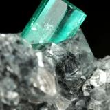 Beryl (variety emerald), Calcite<br />La Pita mining district, Municipio Maripí, Western Emerald Belt, Boyacá Department, Colombia<br />27x34x10mm, xl=10x4.5mm<br /> (Author: Fiebre Verde)