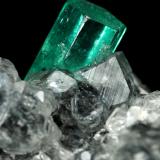 Beryl (variety emerald), Calcite<br />La Pita mining district, Municipio Maripí, Western Emerald Belt, Boyacá Department, Colombia<br />27x34x10mm, xl=10x4.5mm<br /> (Author: Fiebre Verde)