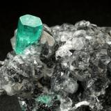 Beryl (variety emerald), Calcite<br />La Pita mining district, Municipio Maripí, Western Emerald Belt, Boyacá Department, Colombia<br />27x34x10mm, xl=10x4.5mm<br /> (Author: Fiebre Verde)