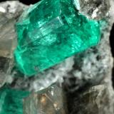 Beryl (variety emerald), Albite (variety cleavelandite), Dolomite<br />La Pita mining district, Cunas Mine, Municipio Maripí, Western Emerald Belt, Boyacá Department, Colombia<br />35x21x16mm, main xl=11x8mm<br /> (Author: Fiebre Verde)