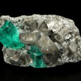 Beryl (variety emerald), Albite (variety cleavelandite), Dolomite<br />La Pita mining district, Cunas Mine, Municipio Maripí, Western Emerald Belt, Boyacá Department, Colombia<br />35x21x16mm, main xl=11x8mm<br /> (Author: Fiebre Verde)