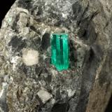 Beryl (variety emerald), Calcite, Pyrite<br />La Pita mining district, Municipio Maripí, Western Emerald Belt, Boyacá Department, Colombia<br />38x63x65mm, xl=10mm<br /> (Author: Fiebre Verde)