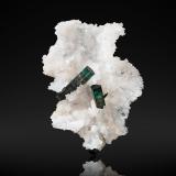 Elbaite on Quartz<br />Santa Rosa Mine, Itambacuri, Vale do Rio Doce, Minas Gerais, Brazil<br />9,5	x	10,0	x	9,5	cm<br /> (Author: MIM Museum)