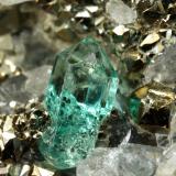 Beryl (variety emerald), Calcite, Pyrite<br />Chivor mining district, El Acuario Mine, Municipio Chivor, Eastern Emerald Belt, Boyacá Department, Colombia<br />33x41x21mm, xl=8mm<br /> (Author: Fiebre Verde)